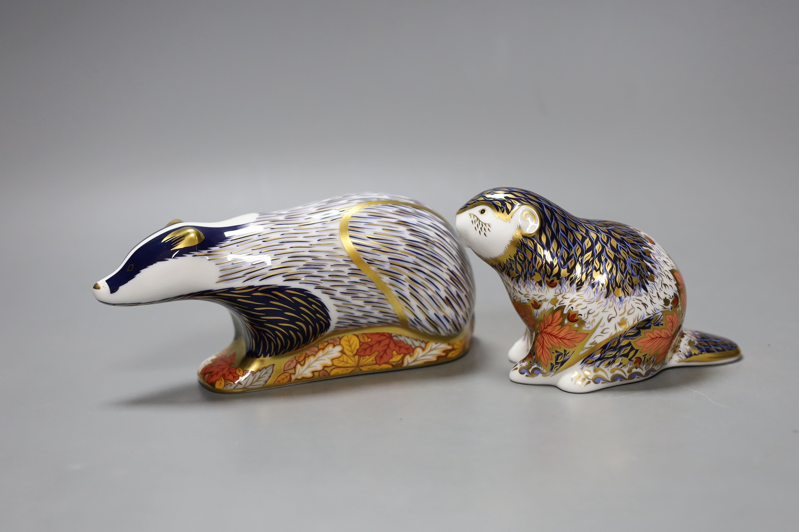 Two Royal Crown Derby paperweights - Riverbank Beaver, limited edition, 1686/5000, gold stopper, boxed with certificate and Woodland Badger, gold stopper, boxed, no certificate.